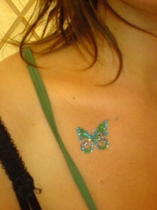 Glitter Butterfly Tattoo On Chest